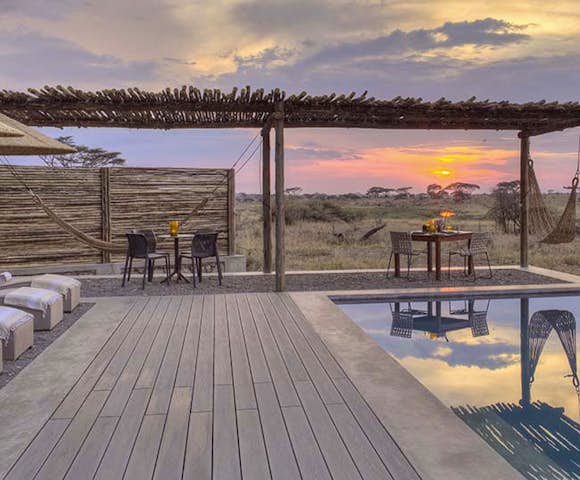 Sun sets over the pool at Namiri Plains, Serengeti